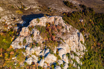 beautiful mountains with unusual ledges and tales against the background of the sky and the valley