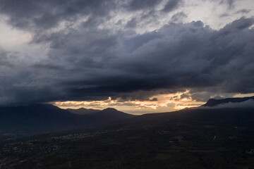beautiful mountains at sunset against the backdrop of storm clouds