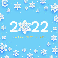 Fototapeta na wymiar New Year concept - 2022 numbers on blue background with paper snowflakes for winter holidays design