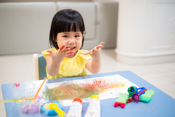 Asian baby girl paint watercolor by her hand. - 384821075
