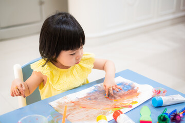 Asian baby girl paint watercolor by her hand. - 384821085