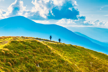 People travelling in mountains, mountain landscape with group of people