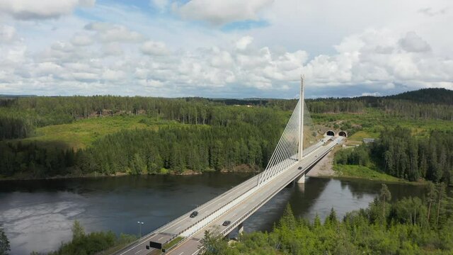Aerial view overlooking cars on road E18, on the Smaalenene Bridge, sunny, summer day, in Spydeberg, Agder, Norway - tracking, drone shot