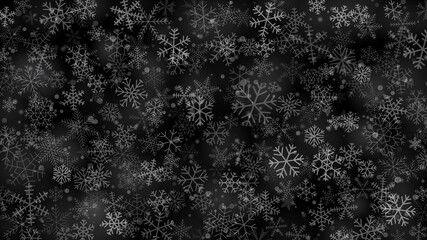 Christmas background of snowflakes of different shapes, sizes and transparency in gray and black colors