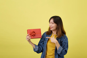 Portrait beautiful young asian woman with red gift box