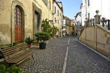 A narrow street among the old houses of Fiuggi, a medieval village in the Lazio region.