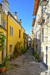 A narrow street among the old houses of Fiuggi, a medieval village in the Lazio region.