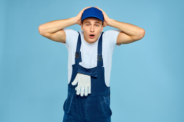 Working man in uniform of gloves loader rendering service blue background