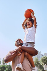 Caring dad holding his kid up while playing basketball