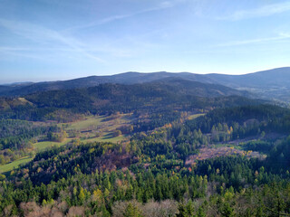 Panorama of the Karkonosze Mountains in early autumn. Mountains, trees and meadows. Karkonosze Mountains