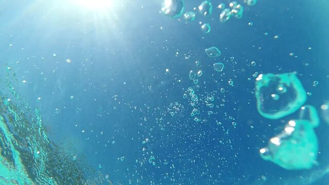 Underwater slow motion video of turquoise exotic empty pool