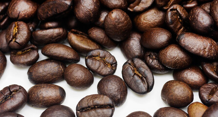 Coffee beans roasted on a white background.