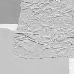 White torn paper collage close-up. Texture made from various paper and cardboard parts. Damaged old...