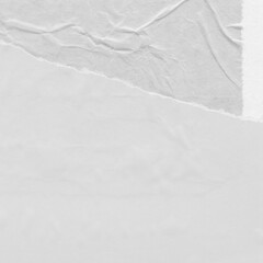 White torn paper collage close-up. Texture made from various paper and cardboard parts. Damaged old paper background. Vintage blank wallpaper. Material design backdrop.