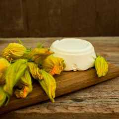 zucchini flowers and ricotta cheese, ready for cooking, outdoor, soft selective focus