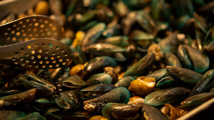 Delicious sea mussels Mussels in shells Selective focus with a pan
