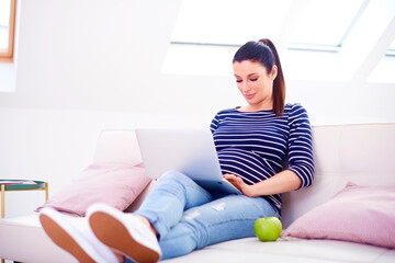 Pregnant woman with laptop