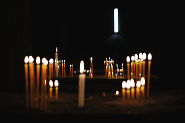 
burning candles in a monastery in armenia