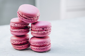 Stack of small macaroon cakes close up