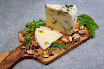 Cheese collection, fresh Italian pecorino cheese made from sheep milk filled with pistachio nuts...