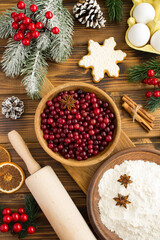Top view of  ingredients for Christmas cranberry pie on the wooden  background