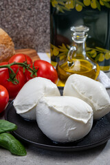 Fresh handmade soft Italian cheese from Campania, white balls of buffalo mozzarella cheese made...