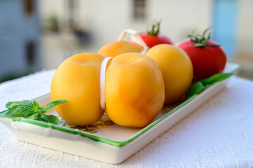 Cheese collection, Italian cheese scamorza made from cow milk in South Italy, white and yellow...