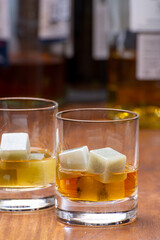 Tasting glass with strong alcoholic spirit drink whisky, cognac, armagnac or calvados