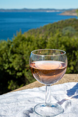 Picnic with of local rose wine and blue Mediterranean sea on background, near Saint-Tropez, Var, Provence, France