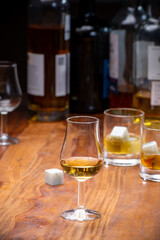 Tasting glass with strong alcoholic spirit drink whisky, cognac, armagnac or calvados