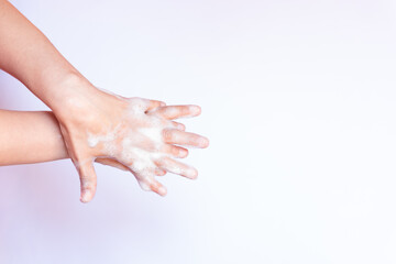 Prevent coronavirus or COVID-19 concept. Handwashing of cleaning hand wash with bubble liquid soap...