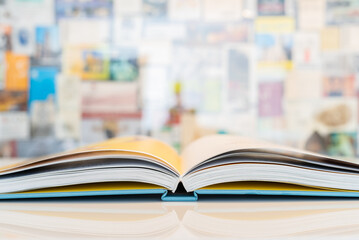 An open book with soft pastel blurred background