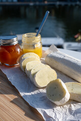Belgian abbey cheese fagotin in pieces with jam served outdoor, Wallonia, Belgium