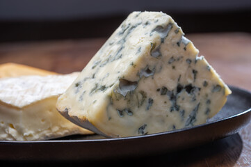 Cheese collection, blue cheese, camembert, brie served as dessert with fig almonds bread