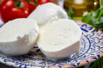 Fresh handmade soft Italian cheese from Campania, white balls of buffalo mozzarella cheese made from cow milk ready to eat
