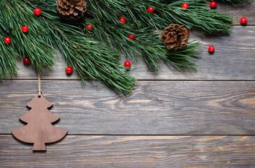 Christmas composition on a brown wooden background. Christmas tree-decor. Flat lay, top view, copy...