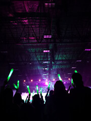 Crowd at concert : Silhouette people crowd happy and cheering with led foam stick light in front of...