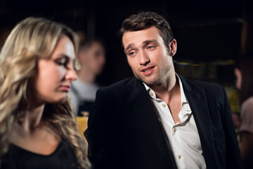 a man meets a beautiful blonde at the bar.