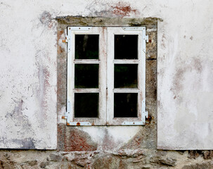 windows of an old mansion, white wall. Galicia Spain
