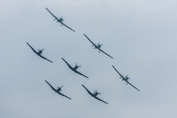 seven planes in formation at the sky during a air show