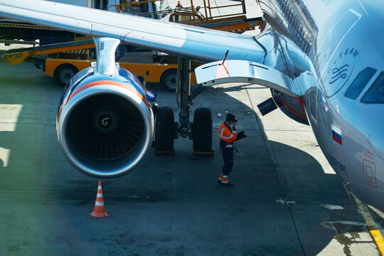 Airport Services Check The Aircraft Systems In The Parking Lot In Sheremetyevo Airport, Moscow