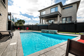 Fototapeta na wymiar Big modern luxury furnished house in Montreal with swimming pool and backyard