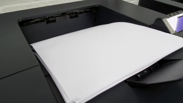 Office laser jet printer printing lots of paper