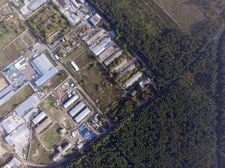  Aerial view of the saburb landscape (drone image).Business and industrial area in the forest. Near Kiev, Ukraine