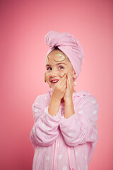 girl in a terry dressing gown and with a towel wrapped around her head