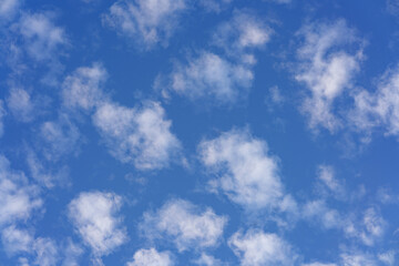 Beautiful small white clouds floating across the blue sky