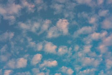 Beautiful small white clouds floating across the blue sky