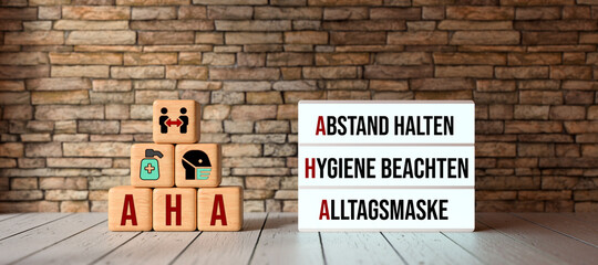 German acronym AHA with a lightbox showing the three rules in a pandemic HOLD DISTANCE, FOLLOW...