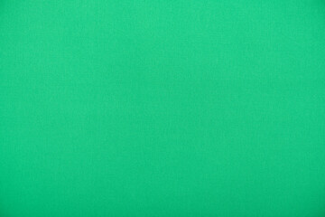 Natural green textile, smooth fabric as texture or background, high resolution
