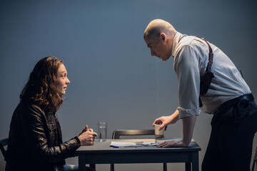 An experienced investigator conduct an interview at the police station.